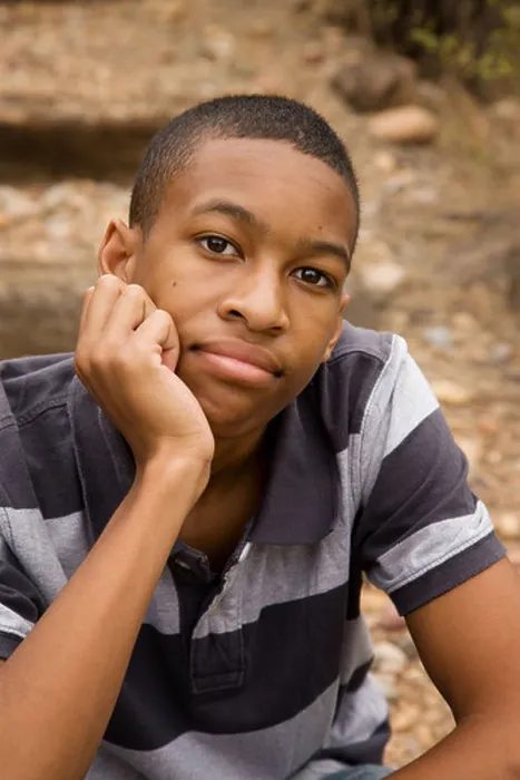 Framed Print : Handsome African-American Male sitting in an outdoor setting Framed Print : Handsome African-American Male sitting in an outdoor setting