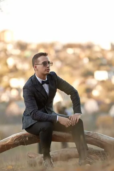 Framed Print : Handsome young man in classic checked suit and sunglasses outdoor