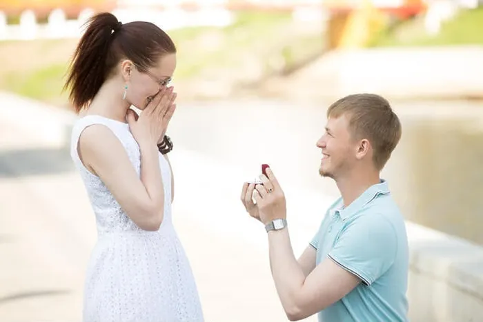 Framed Print : Handsome young man requesting hand of beloved pretty girlfriend Framed Print : Handsome young man requesting hand of beloved pretty girlfriend