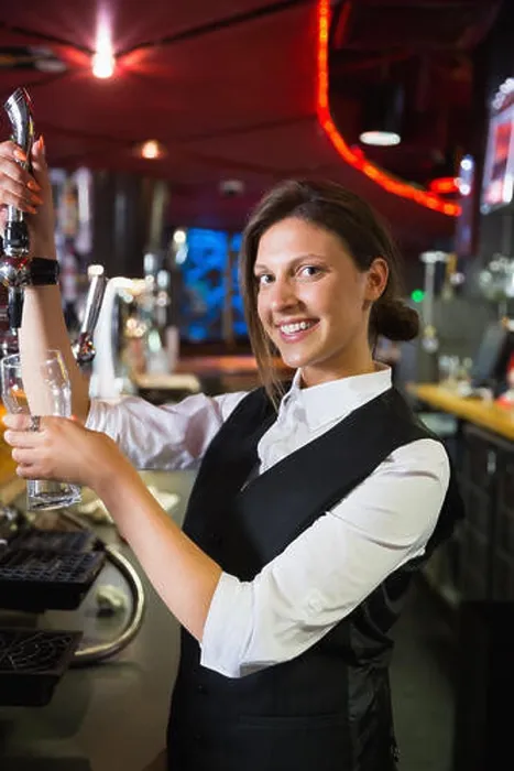 Framed Print : Happy barmaid pulling a pint of beer Framed Print : Happy barmaid pulling a pint of beer