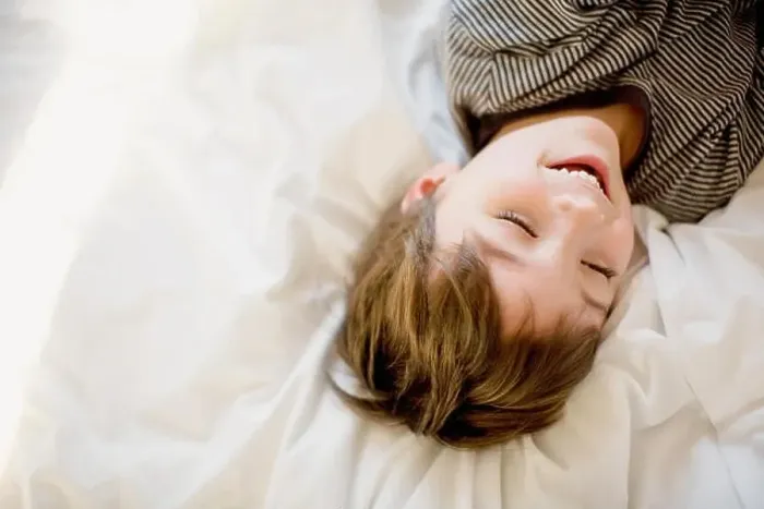 Framed Print : Happy boy lying on the bed Framed Print : Happy boy lying on the bed