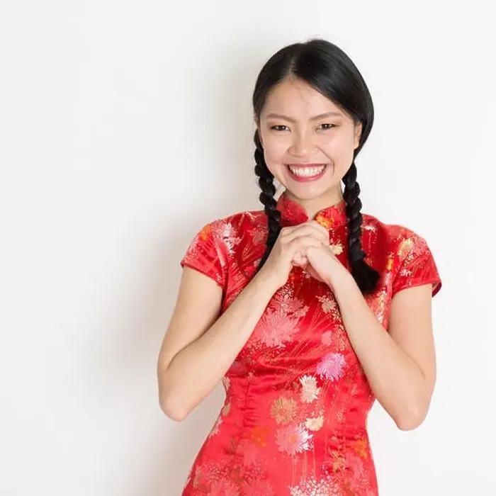 Framed Print : Happy Chinese New Year!! Portrait of Asian Chinese girl greeting, in traditional red qipao standing on plain background Framed Print : Happy Chinese New Year!! Portrait of Asian Chinese girl greeting, in traditional red qipao standing on plain background