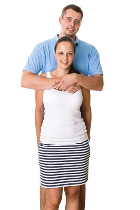 Framed Print : Happy couple standing behind each other Framed Print : Happy couple standing behind each other