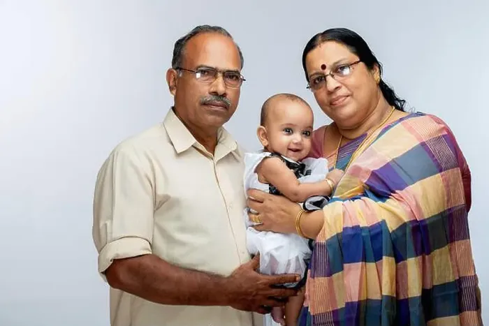 Framed Print : Happy Indian Family, grand parents and baby girl, isolated on white background Framed Print : Happy Indian Family, grand parents and baby girl, isolated on white background
