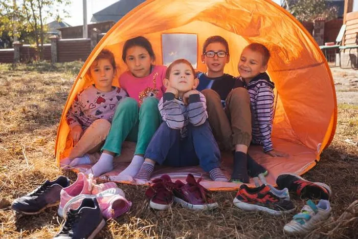 Framed Print : Happy kids - boys and girls in a tent outdoor Framed Print : Happy kids - boys and girls in a tent outdoor