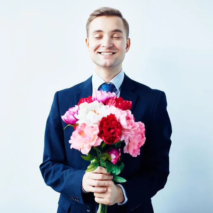 Framed Print : Happy young man holding bunch of fresh peonies Framed Print : Happy young man holding bunch of fresh peonies