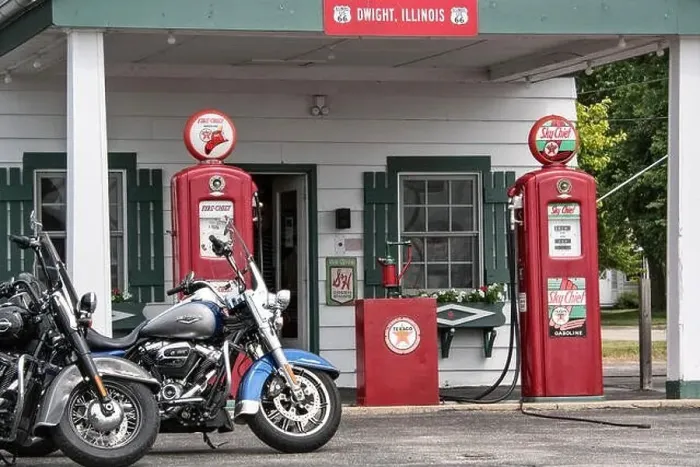 Framed Print : Harley Davidson motorcycles parked in front of historic gas station Framed Print : Harley Davidson motorcycles parked in front of historic gas station