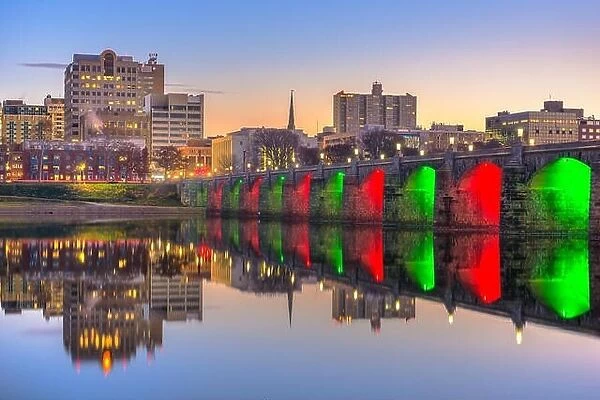 Harrisburg, Pennsylvania, USA skyline on the Susquehanna River with holiday lighting