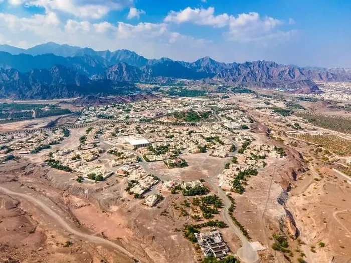 Framed Print : Hatta town aerial cityscape surrounded by Hajar mountains in Hatta enclave of Dubai in the United Arab Emirates aerial Framed Print : Hatta town aerial cityscape surrounded by Hajar mountains in Hatta enclave of Dubai in the United Arab Emirates aerial
