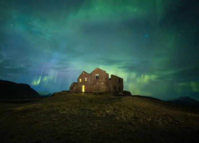 Framed Print : A hauntingly beautiful scene with an abandoned house bathed in the ghostly green glow of the Northern Lights under a Framed Print : A hauntingly beautiful scene with an abandoned house bathed in the ghostly green glow of the Northern Lights under a