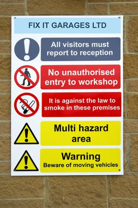 Framed Print : A Health and Safety sign outside a garage workshop Framed Print : A Health and Safety sign outside a garage workshop