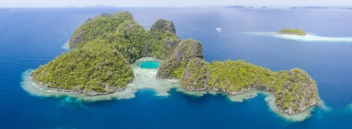 Framed Print : Healthy coral reefs surround the limestone islands found in Raja Ampat, Indonesia. This remote, tropical region is known for its marine biodiversity Framed Print : Healthy coral reefs surround the limestone islands found in Raja Ampat, Indonesia. This remote, tropical region is known for its marine biodiversity