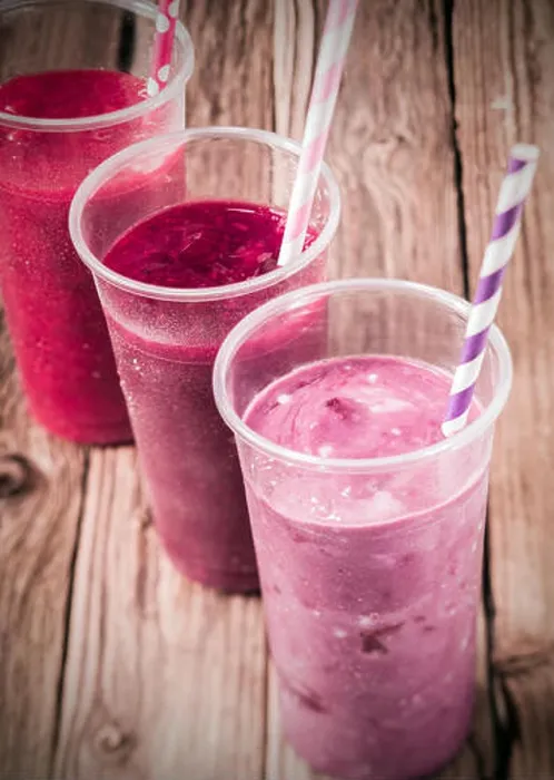 Framed Print : Healthy delicious trio of different berry smoothies with low fat yogurt arranged in a diagonal row