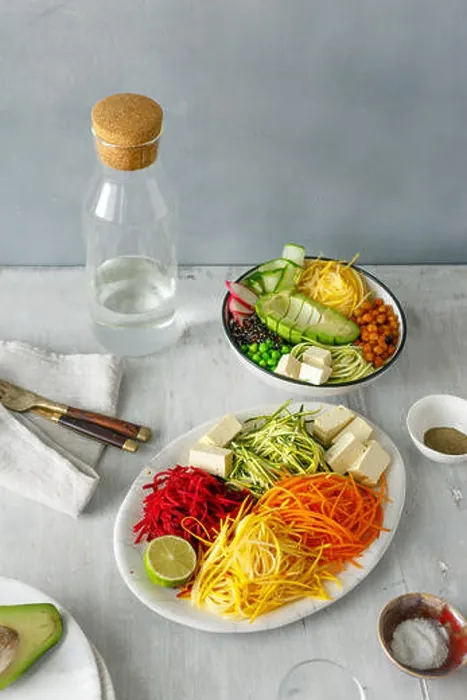 Framed Print : Healthy food clean eating. Spiralized vegetables with bowl of buddha on white wooden table Framed Print : Healthy food clean eating. Spiralized vegetables with bowl of buddha on white wooden table