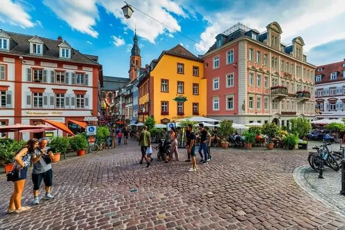 Framed Print : Heidelber, Germany - July 6, 2019: Marketplace crowded with tourists and Town Hall in Heidelberg in Germany Framed Print : Heidelber, Germany - July 6, 2019: Marketplace crowded with tourists and Town Hall in Heidelberg in Germany