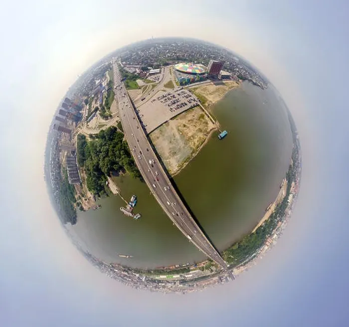 Framed Print : Helicopter drone shot. Aerial photography of a river with bridge Framed Print : Helicopter drone shot. Aerial photography of a river with bridge