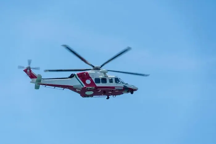 Framed Print : a helicopter flies in the blue sky Framed Print : a helicopter flies in the blue sky