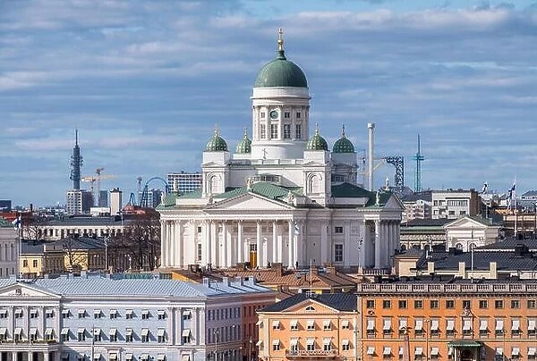 Helsinki, Finland - April 14 : Cathedral and other city buildings with central cityscape in Helsinki on April 14, 2019. With beautiful evening light