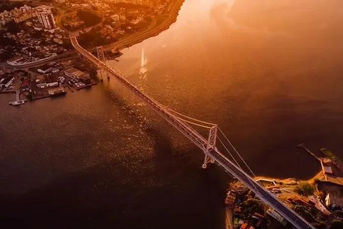 Framed Print : Hercilio luz cable bridge with sunset light in Florianopolis, Brazil. Aerial view Framed Print : Hercilio luz cable bridge with sunset light in Florianopolis, Brazil. Aerial view