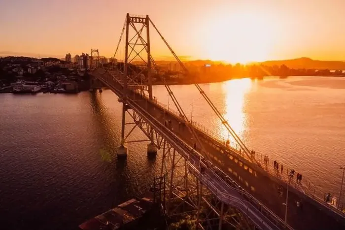 Framed Print : Hercilio luz old cable bridge with golden sunset sky in Florianopolis. Drone view
