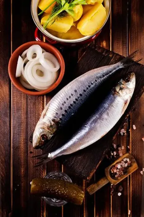 Framed Print : Herring or Baltic herring with salt on dark backgruond Framed Print : Herring or Baltic herring with salt on dark backgruond