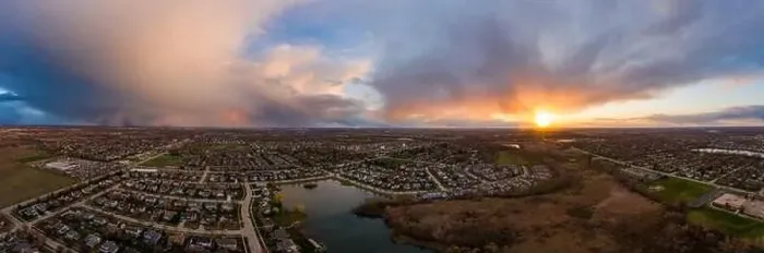 Framed Print : A high, aerial drone view of storm clouds at sunset with an Illinois neighborhood in the foreground Framed Print : A high, aerial drone view of storm clouds at sunset with an Illinois neighborhood in the foreground