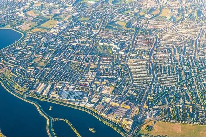 Framed Print : High angle above aerial bird's eye drone view from airplane over city of London in United Kingdom with terraced houses Framed Print : High angle above aerial bird's eye drone view from airplane over city of London in United Kingdom with terraced houses