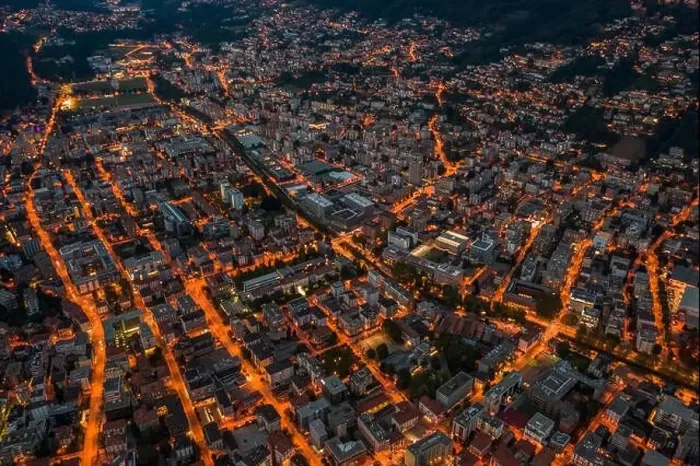 Framed Print : High angle aerial drone night shot of city street lights in Lugano, Switzerland Framed Print : High angle aerial drone night shot of city street lights in Lugano, Switzerland