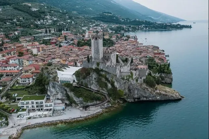 Framed Print : High angle aerial drone shot view of Castello Malcesine village in Italy Framed Print : High angle aerial drone shot view of Castello Malcesine village in Italy