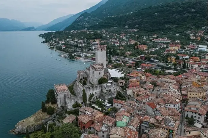 Framed Print : High angle aerial drone shot view of Malcesine Coastline by lake garda in Italy Framed Print : High angle aerial drone shot view of Malcesine Coastline by lake garda in Italy