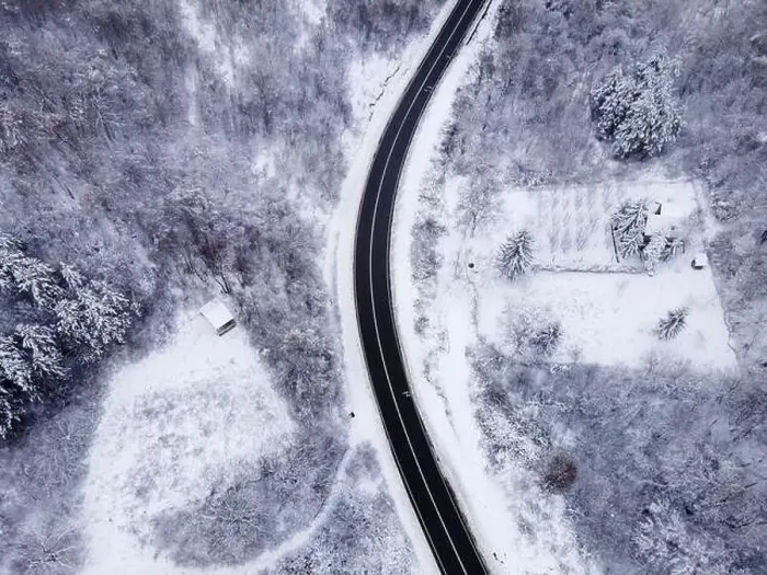Framed Print : High angle top down aerial view drone image on road trough the trees