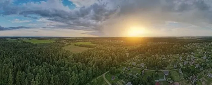 Framed Print : High View from the height of a flying drone, a small village with houses and cottages, green fields on a summer day Framed Print : High View from the height of a flying drone, a small village with houses and cottages, green fields on a summer day