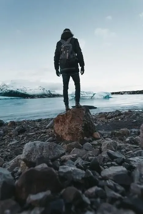 Framed Print : Hiking on a glacier in Iceland, breathtaking views, traveler stands on stone Framed Print : Hiking on a glacier in Iceland, breathtaking views, traveler stands on stone