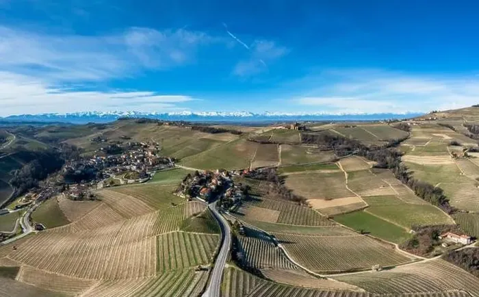 Framed Print : the hilly countryside in the Italian Piedmont with the village of Barolo and snow-covered mountains behind Framed Print : the hilly countryside in the Italian Piedmont with the village of Barolo and snow-covered mountains behind
