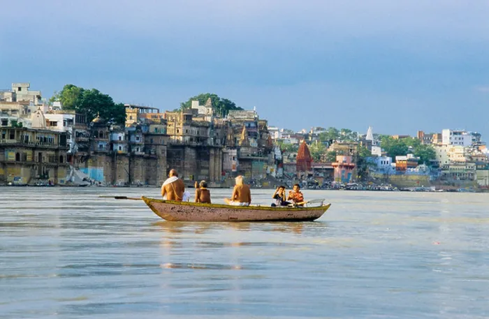 Framed Print : Hindu pilgrims at dawn in a boat on the river Ganges in Varanasi, India Framed Print : Hindu pilgrims at dawn in a boat on the river Ganges in Varanasi, India