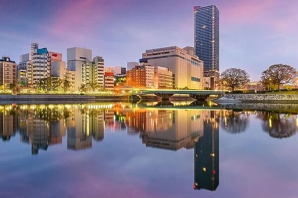 Hiroshima, Japan city skyline on the river at twilight