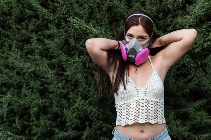 Framed Print : Hispanic female wearing full face respirator gas mask and latex gloves outdoors Framed Print : Hispanic female wearing full face respirator gas mask and latex gloves outdoors