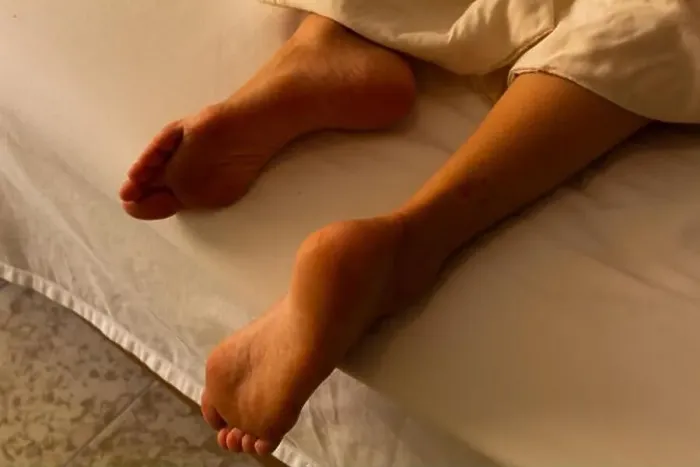 Framed Print : Hispanic woman resting in hotel bed Framed Print : Hispanic woman resting in hotel bed