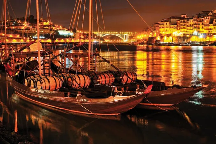 Framed Print : Historic port wine ships with wine barrels anchoring on Douro river by night Framed Print : Historic port wine ships with wine barrels anchoring on Douro river by night