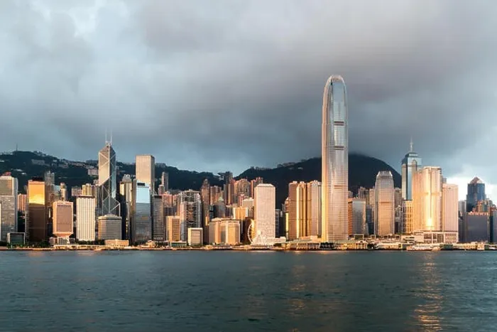 Framed Print : Hong Kong skyline with sunlight in the morning over Victoria Harbour in Hong Kong Framed Print : Hong Kong skyline with sunlight in the morning over Victoria Harbour in Hong Kong