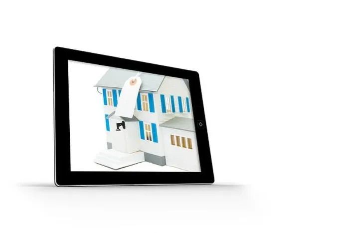 Framed Print : House with price tag on tablet screen Framed Print : House with price tag on tablet screen