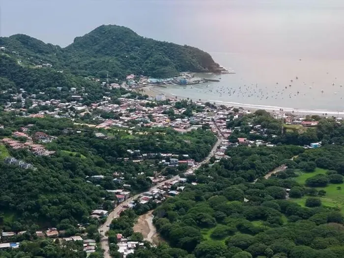 Framed Print : Houses on main street in San juan Del Sur town aerial drone view Framed Print : Houses on main street in San juan Del Sur town aerial drone view