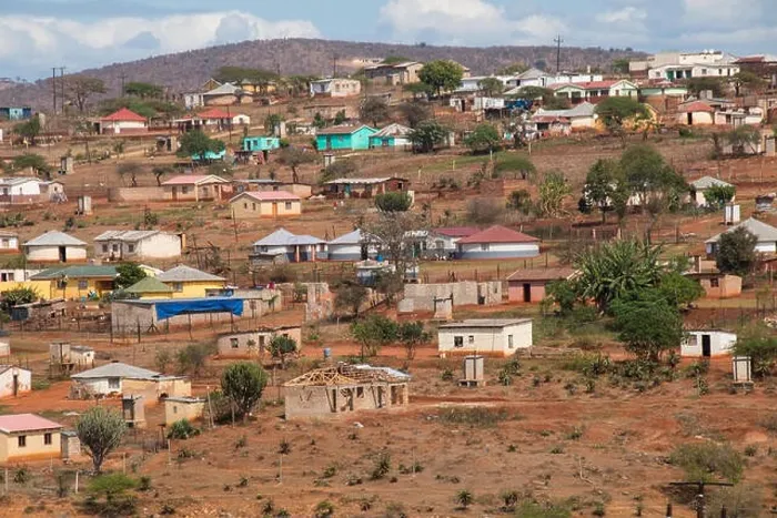 Framed Print : Housing and huts scattered informally on hill in rural south africa Framed Print : Housing and huts scattered informally on hill in rural south africa