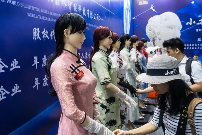 Framed Print : Human-like robot (humanoid robot) touch exhibit at technology fair in Shenzhen, China Framed Print : Human-like robot (humanoid robot) touch exhibit at technology fair in Shenzhen, China