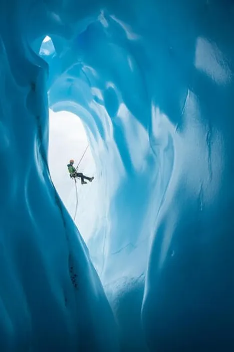 Framed Print : An ice climber in a green jacket Framed Print : An ice climber in a green jacket