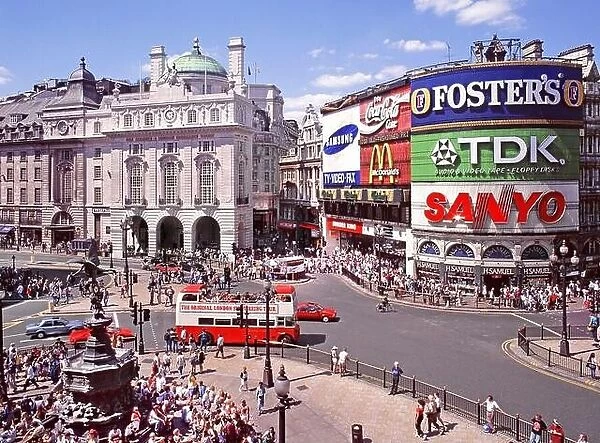 Iconic London West End 1995 tourism aerial archive image looking down on crowds of tourists around Eros statue