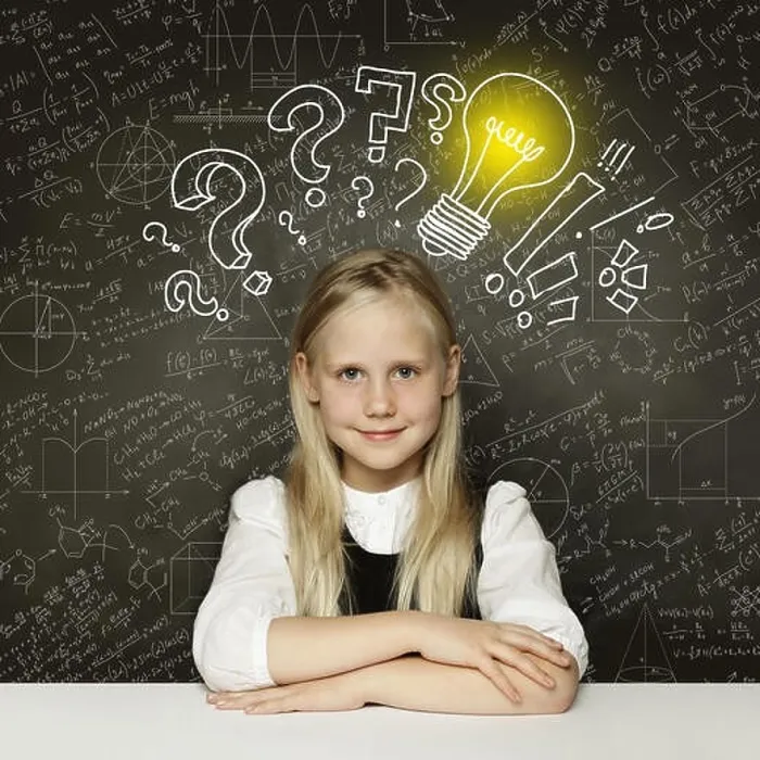 Framed Print : Idea! Smiling student girl with lightbulb on blackboard Framed Print : Idea! Smiling student girl with lightbulb on blackboard