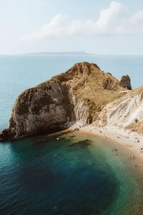 Framed Print : From above idyllic seascape with rocks called Durdle Door and people relaxing on seashore on summer day Framed Print : From above idyllic seascape with rocks called Durdle Door and people relaxing on seashore on summer day