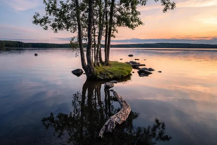 Framed Print : Idyllic smalll island with tranquil lake and beautiful sunset at summer evening in Finland Framed Print : Idyllic smalll island with tranquil lake and beautiful sunset at summer evening in Finland