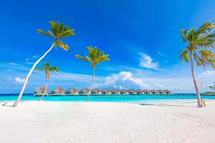 Framed Print : Idyllic tropical beach landscape with water villas and bungalows. Design of tourism summer vacation holiday destination concept. Luxury island beach Framed Print : Idyllic tropical beach landscape with water villas and bungalows. Design of tourism summer vacation holiday destination concept. Luxury island beach